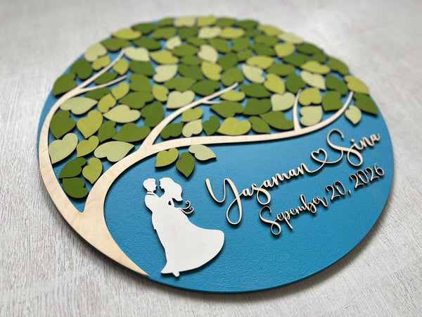 Decorative plaque with a tree design, couple silhouette, and personalized text on a blue background.