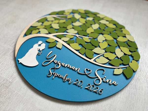Personalized wooden wedding guest book alternative with a couple silhouette, tree design, and text on a light blue background