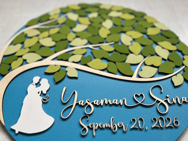 Decorative wall art with a couple silhouette, tree design, and personalized text on a blue background.