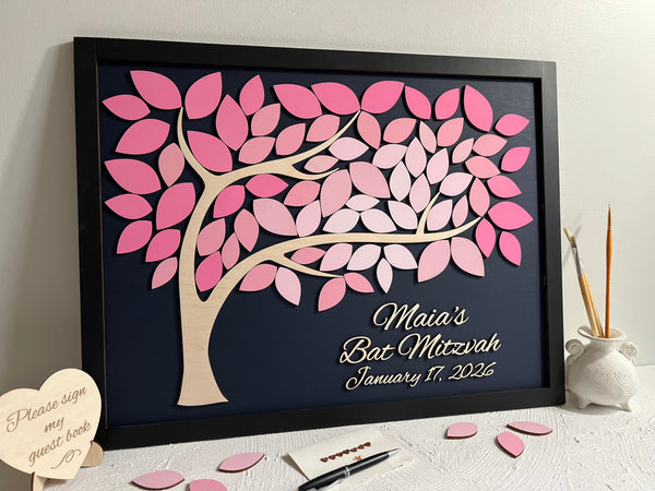 Decorative tree with pink leaves on a black background, featuring personalized text with a black frame