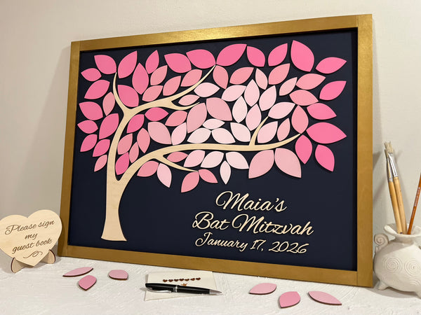 Decorative wall art with a pink tree design for a Bat Mitzvah celebration, featuring personalized text for the celebration and a gold frame