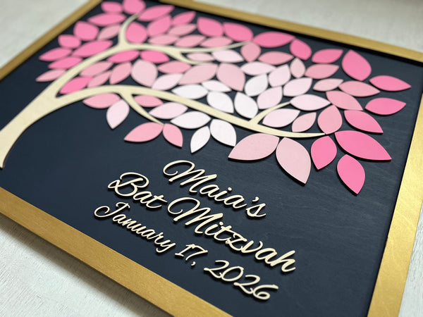 Decorative plaque with pink leaf design and personalized text for a Bat Mitzvah celebration.