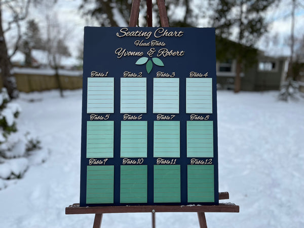 Personalized seating chart on an easel outdoors in a snowy setting