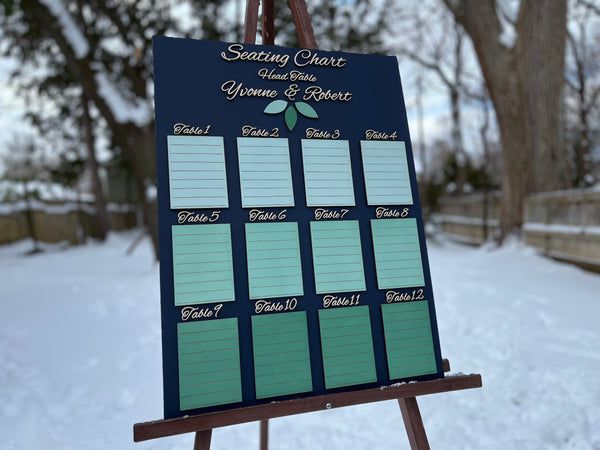 Seating chart on an easel outdoors in a snowy setting