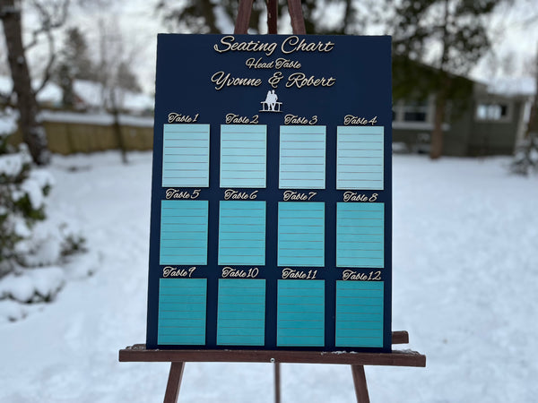 Seating chart on an easel outdoors in a snowy setting