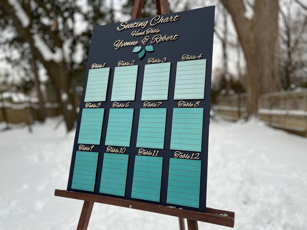 Seating chart for a wedding on an easel outdoors in winter