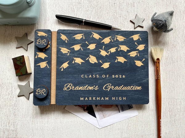 Graduation-themed notebook personalized with engraved text and with decorative elements shown with decorative elements