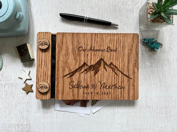 our adventure book wedding guest book with engraved mountains and names and wedding date