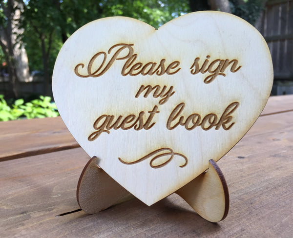 sign to ask your guests to sign your guest book