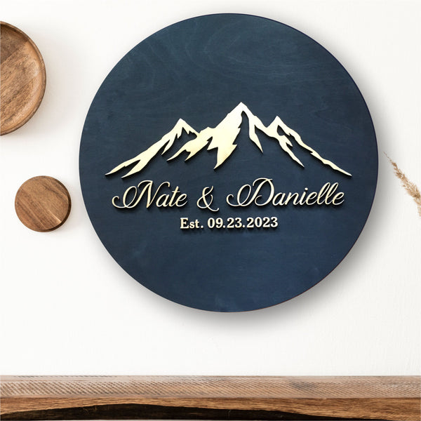 personalized round sign with mountains Alberta wedding guest book