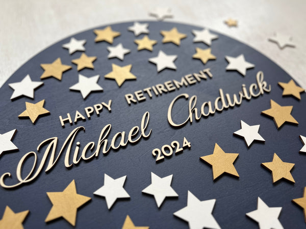 detail of retirement guest book with gold stars