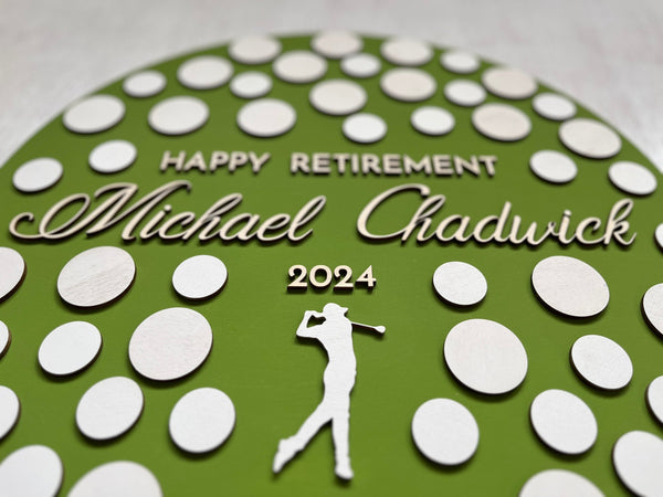 detail to show golfer silhouette and the personalized name of the retiree on the retirement guest book
