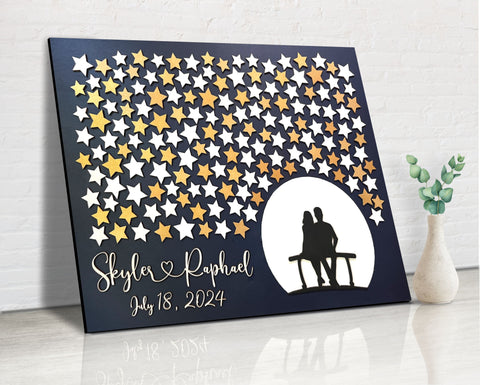 personalized guest book alternative made of wood with stars to sign and couple sitting on bench