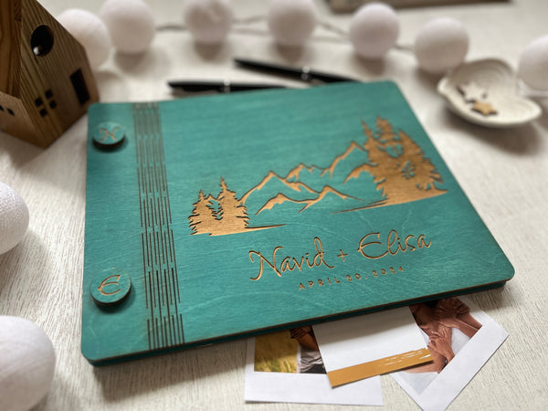 adventure book for newlyweds personalized with couple name, wedding date and mountain scenery