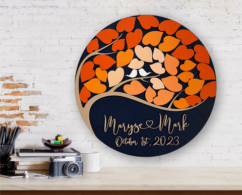 round wedding guest book with personalized details and orange leaves for signing