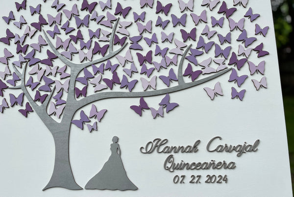 detail to show silver name, silhouette and tree on Quinceanera guest book alternative with personalized name and date with purple butterflies to sign