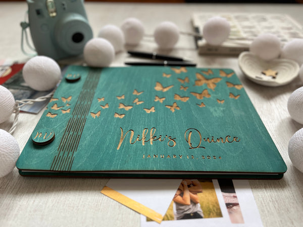 quinceaneara or sweet 16 guest book with personalized details and butterflies with teal wood covers