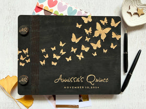 quince guest book in black stain with engraved butterflies