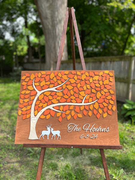 the guest book is personalized with the last name and wedding or anniversary date