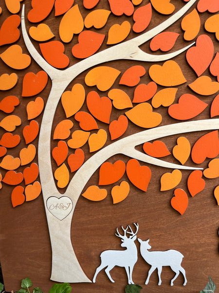 detail of deer on a wedding guest book alternative with leaves to sign