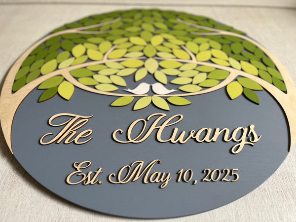 detail of magnetic guest book set with green leaves and grey background personalized with last name and wedding date