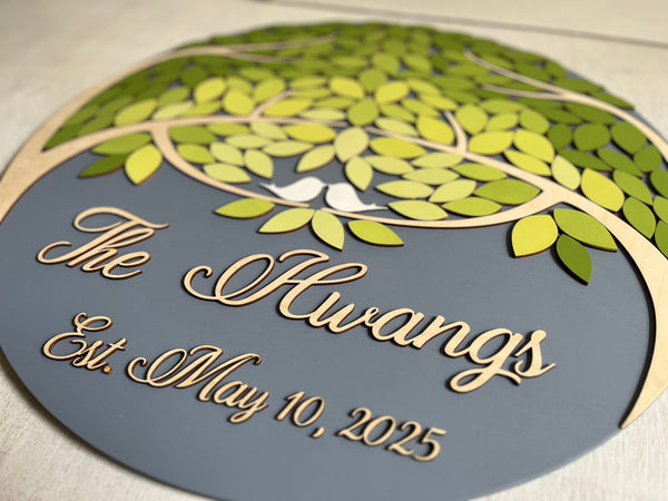 side detail of magnetic guest book set with green leaves and grey background personalized with last name and wedding date
