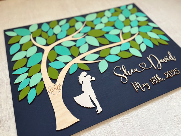 detail of spring wedding guest book alternative with tree of life and personalized names and wedding date