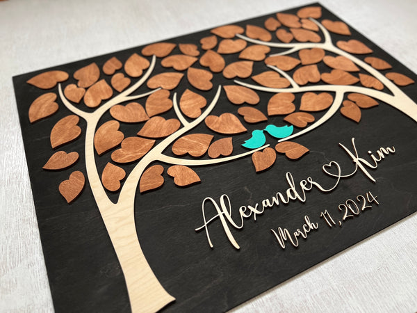 the leaves are signed by the wedding guests and these signatures go along the personalized names of the bride and groom for a long lasting keepsake for the newlyweds home