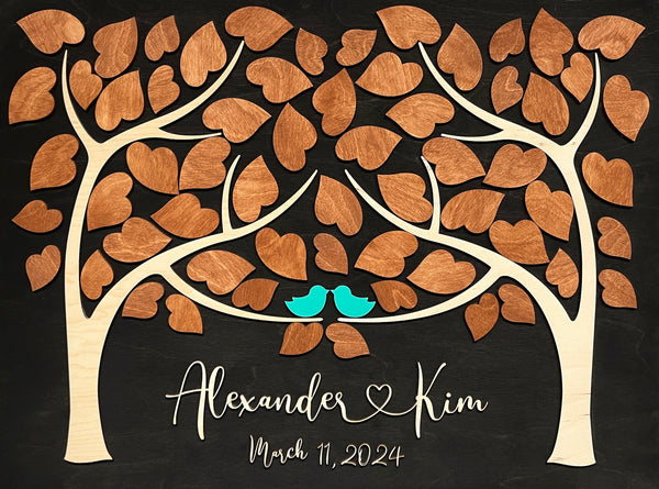 wedding guest book personalized with two trees and the couple name and wedding date