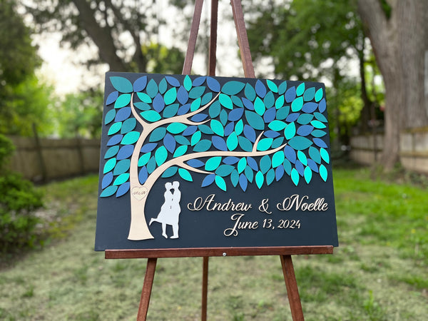 unique guest book with personalized names and wedding date and custom color leaves for guests to sign