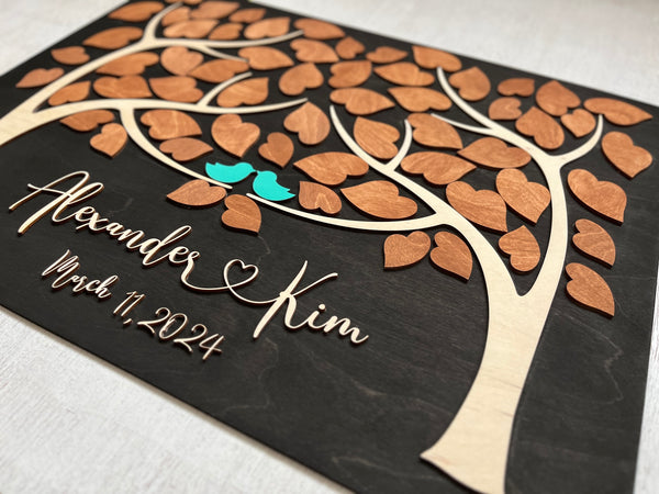 detailed look for the names in wood cutout lettering on the wedding guest book