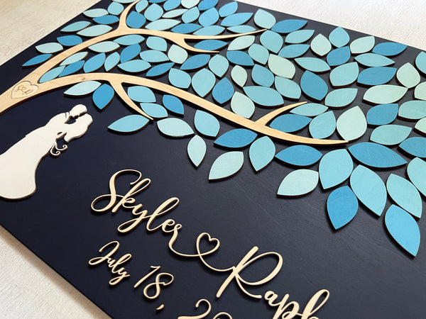 side detail of guest book alternative with blue leaves to sign