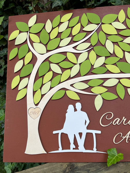 detail of spring wedding guest book alternative with tree of life and leaves for signatures
