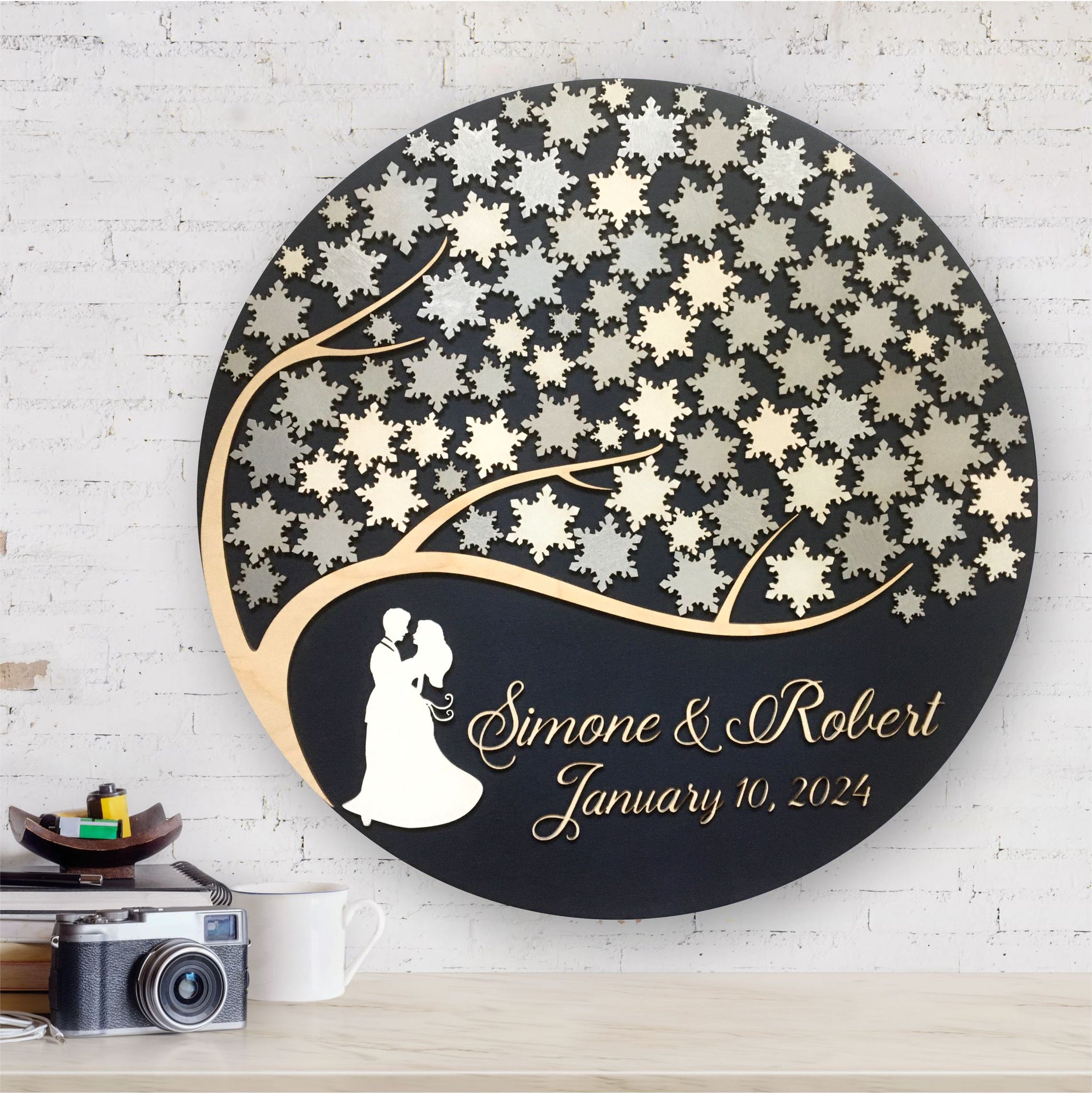 winter wedding guest book alternative with snowflakes and embracing couple