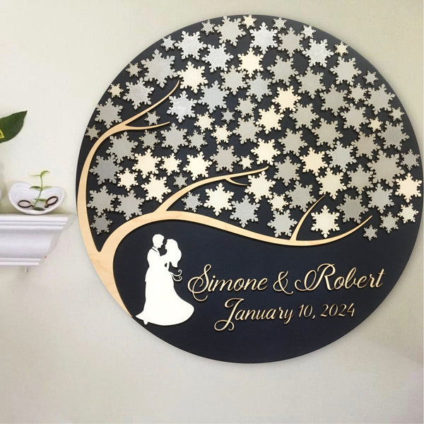 the guest book can be displayed at the wedding and be part of your home decor with snowflakes and personalized names