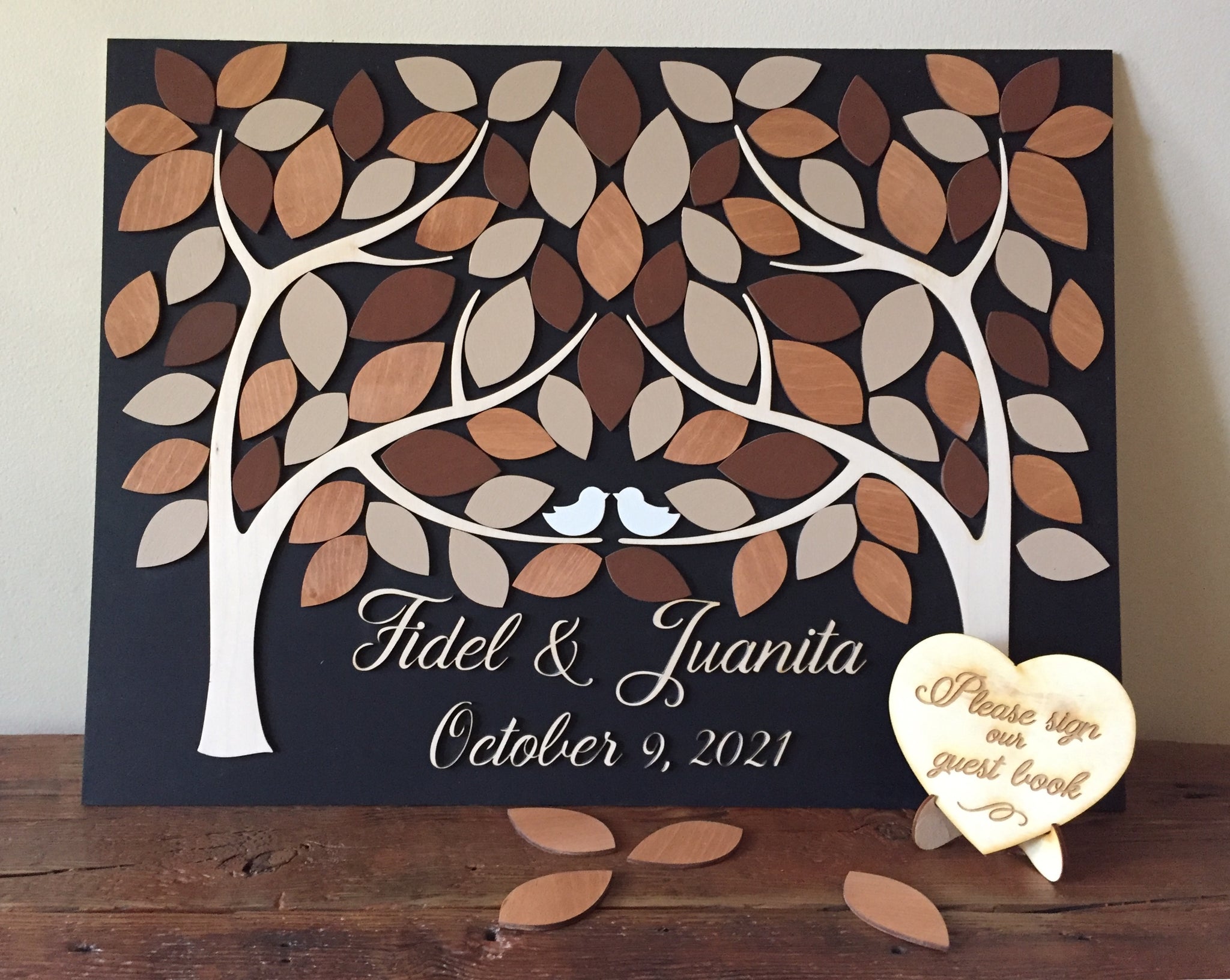Custom wood guest book alternative with personalized details and colors, made with two trees that grow together