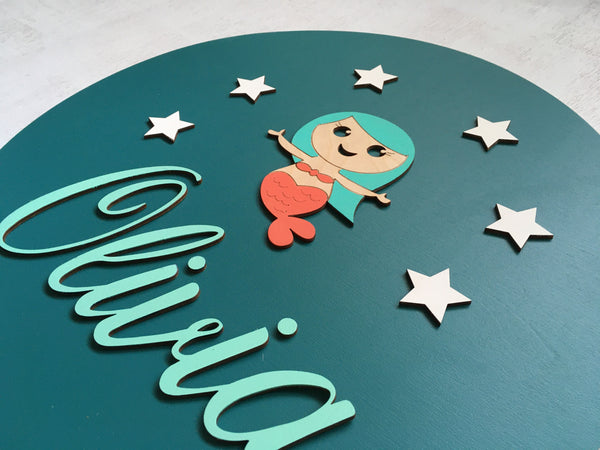 Details showing the name, mermaid and stars that are carefully arranged and painted in custom colors