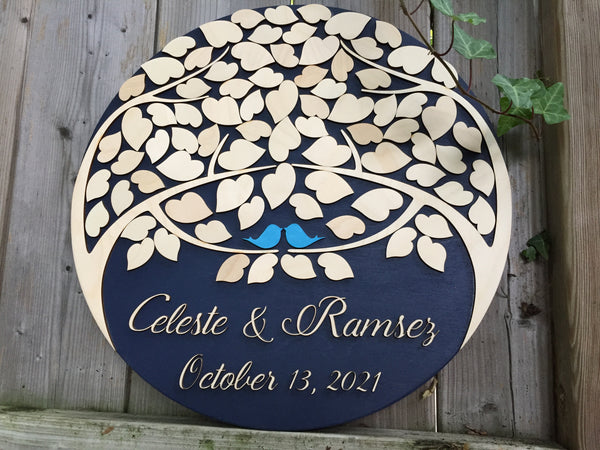 Discover a unique custom guest book alternative round sign with tree of life and leaves to sign to make for an evocative piece of wall art with personalized names, date and colors