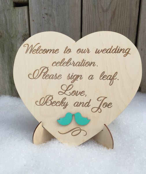 Heart welcome sign for guest book to ask your guests to sign a heart or a leaf on your guestbook alternative made on wood and custom engraved on signyoustyle.com