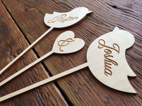 side detail of rustic engraved cake topper