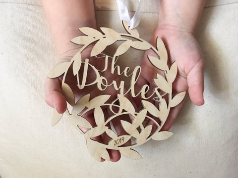 Personalized Christmas ornament with family name and engraved established year