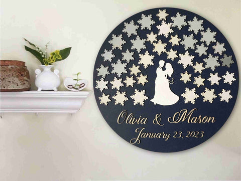 Snow globe guest book with custom names and couple surrounded by snowflakes for winter wedding