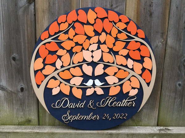 The example is made on a navy background and fading orange leaves, with the darkest shade on the exterior and closing in the white birds with the paler shades of orange to create a pleasant ombre effect 