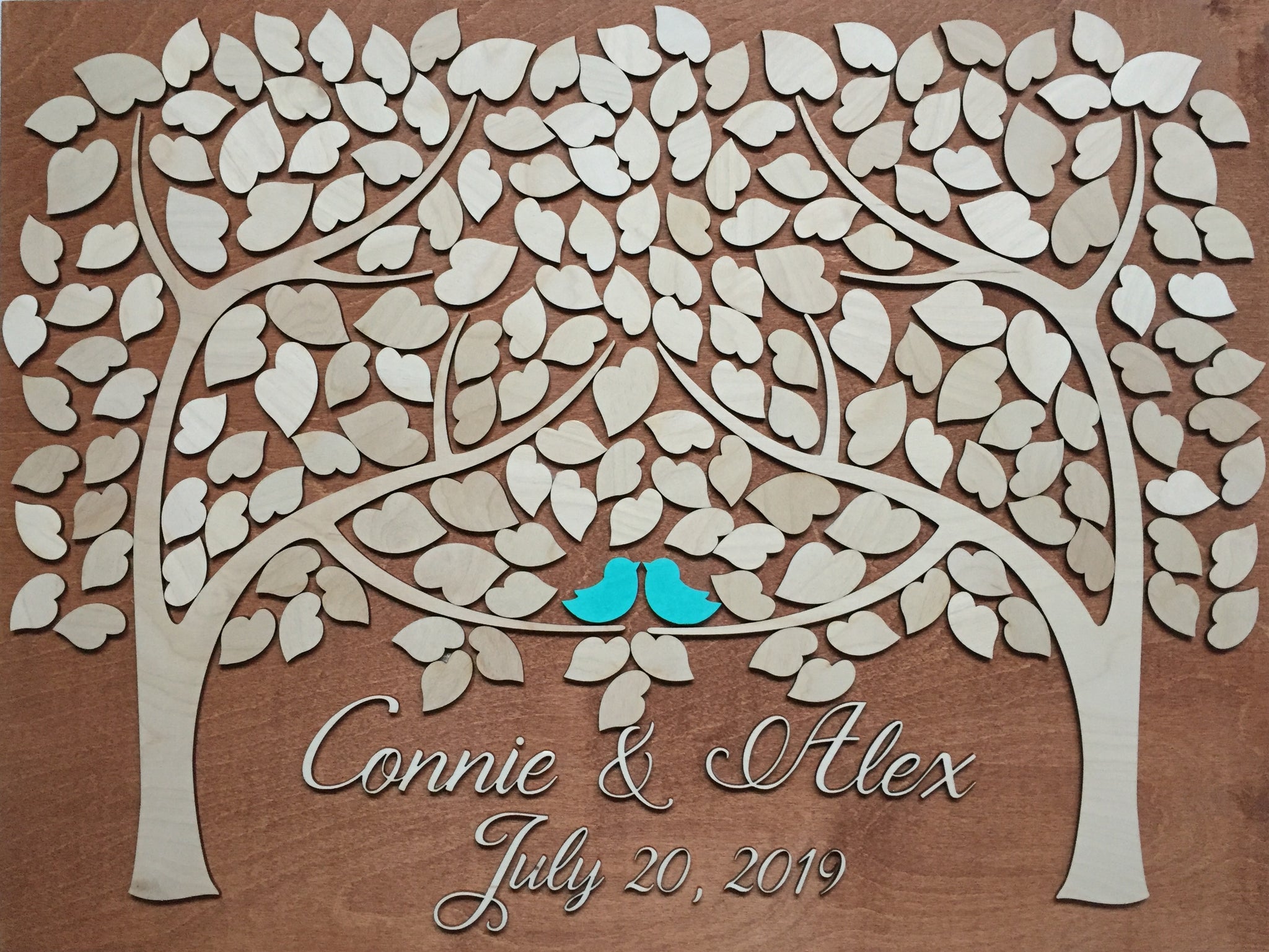 Wedding guest book made of wood representing two family trees that