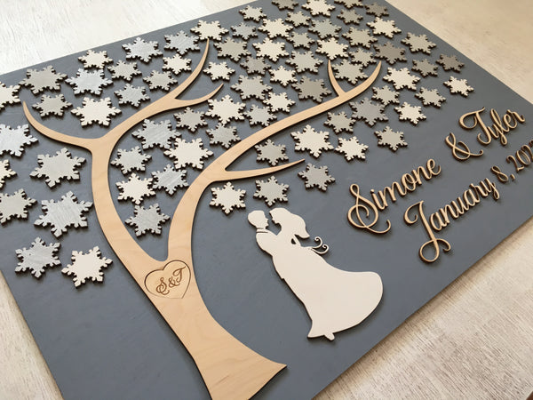 a guest book made with snwflakes suitable for a winter New Years or Christmas wedding