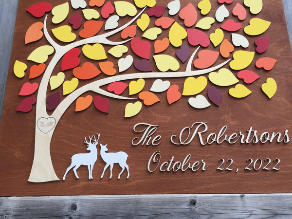 deer guest book with fall colors persoanlized with the last name of the married couple and with leaves to sign