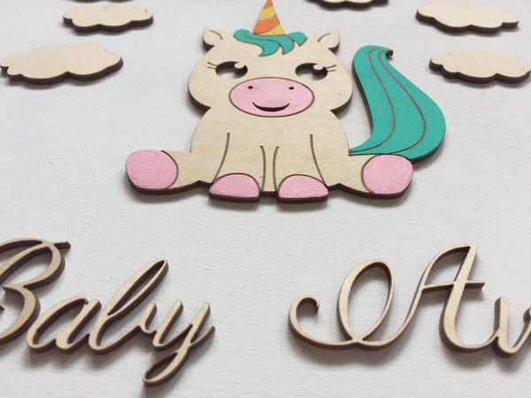 detail of unicorn guest book baby girl baptism
