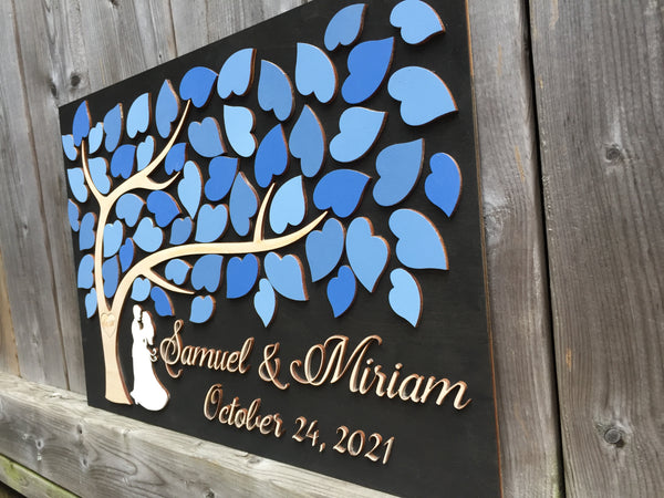 detail of Alternative Guest book made in 3D wood with couple under tree of life