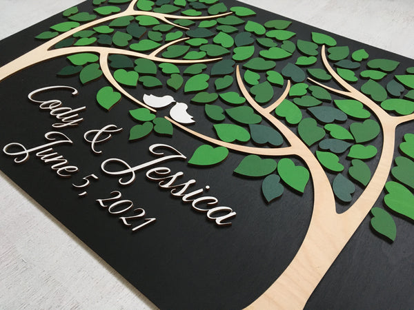 detail of green guest book with two trees signyoustyle.com