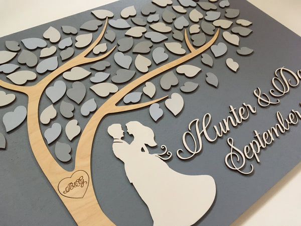 detail of grey wedding guest book alternative with fairy tale couple